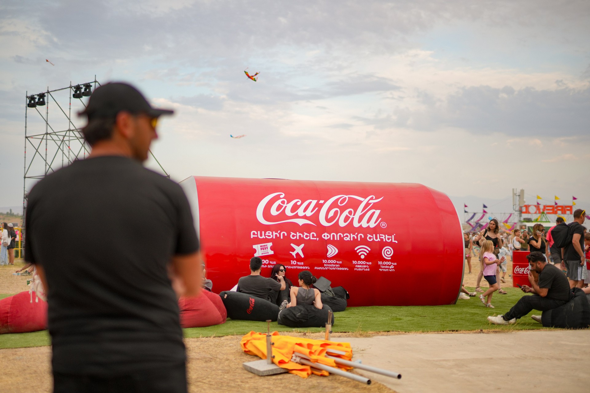 Coca-Cola branded activation tunnel with festival-goers