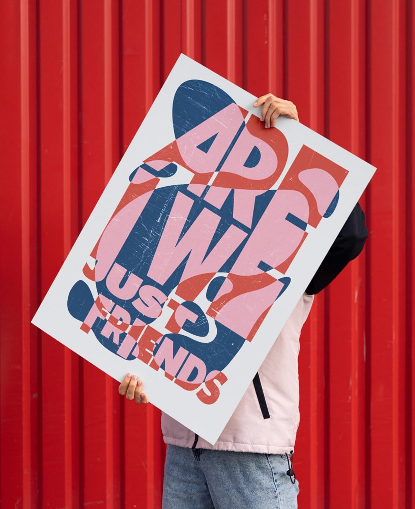 Are We Just Friends poster held against a red corrugated wall