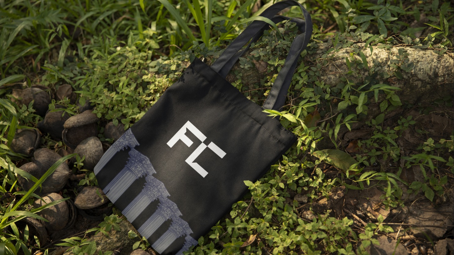 Fiberglass Columns branded tote bag mockup outdoors